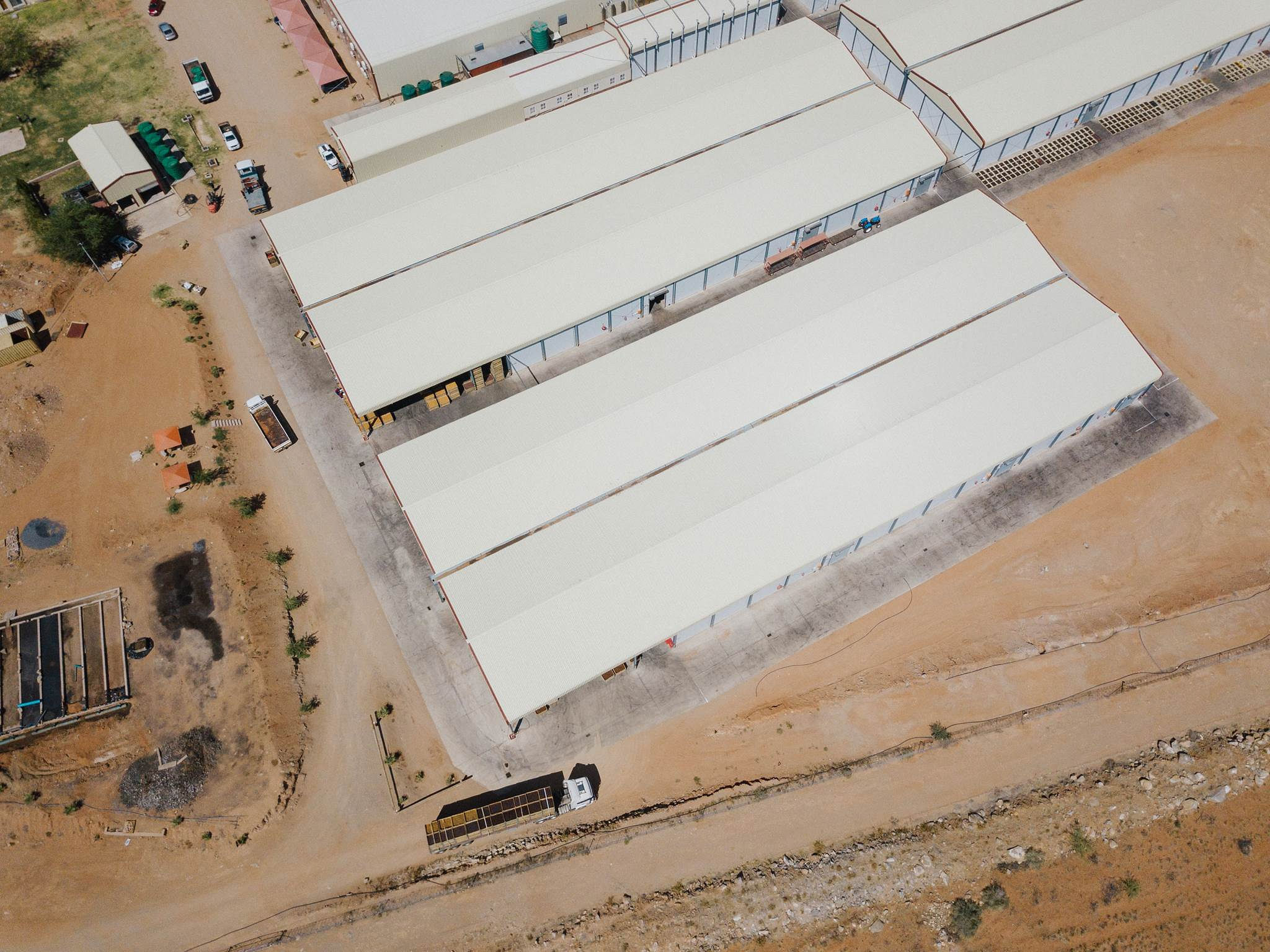 Aerial view of the Red Sun processing facility and storage sheds